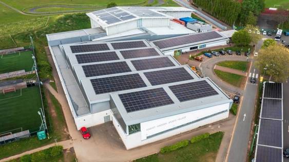 A building with solar panels on the roof

AI-generated content may be incorrect.