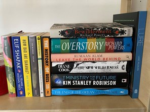 Books about climate change on a bookshelf